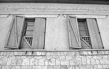 Great big window with huge wood shutters in black and white