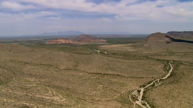 Barren foothills near El Paso, Texas; passenger POV