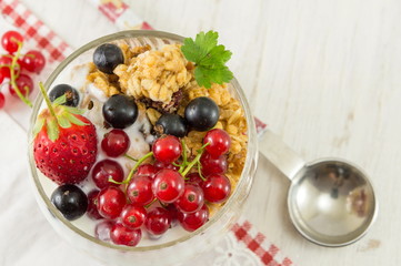 Granola parfait with berry fruit and cream.