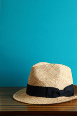 Straw Hat with Blue Wall