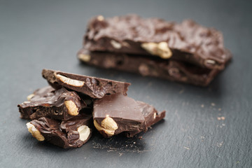 broken homemade bar of chocolate with cashew nuts reverse side