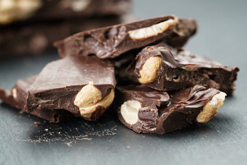 broken homemade bar of chocolate with cashew nuts reverse side