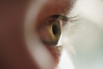 green teen girl eye closeup side view