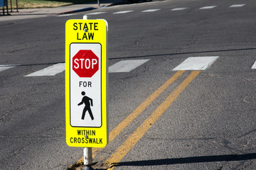 State law Stop for Pedestrians sign in the middle of the road