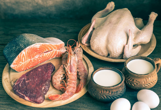 Protein diet: raw products on the wooden background