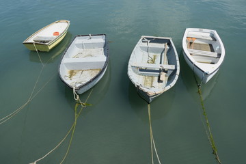 Four boats tied with ropes