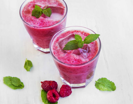Iced raspberry smoothie with mint leaves