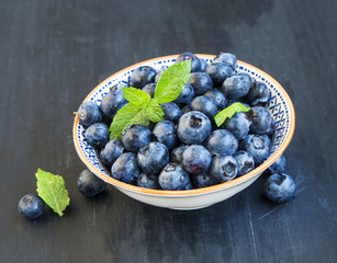 Fresh blueberries with mint leaves
