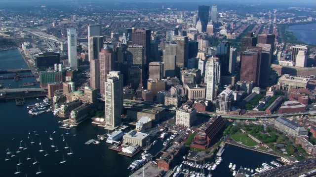 Flight over Boston Harbor with cityscape view. Shot in 2003.