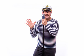 Male sailor singer on microphone on white back