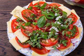 Vegetarian salad with cheese and tomatoes