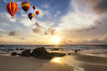 Colorful balloons flying over the sea