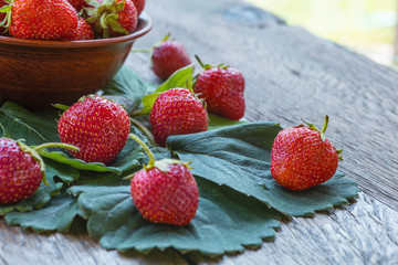 Fresh ripe strawberries on a wooden table