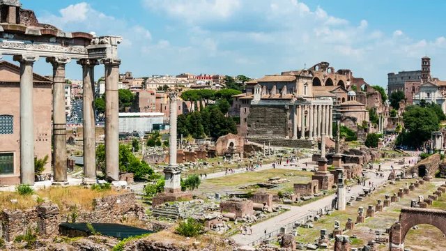 Aerial view of Roman forum in Rome, Italy at day. Time-lapse of people walking inside the popular landmark. Cloudy blue sky.