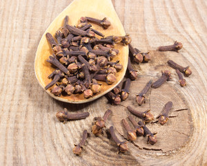 Cloves on a wood board.