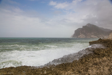 Fototapeta na wymiar Cliffson the beach of Mughsayl (Mughsail) in Salalah, Oman