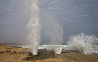 Blowholes on the beach of Mughsayl (Mughsail) in Salalah, Oman