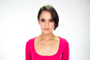 Obraz premium Girl in a pink dress on a white background
