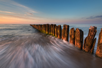 A breakwater on a sandy beach in Wladyslawowo, Poland, Europe. Baltic sea.
