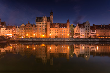 Fototapeta na wymiar Medieval waterfront reflecting in river, Gdansk, Poland