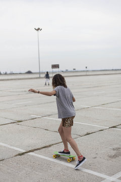 Young woman skateboarding