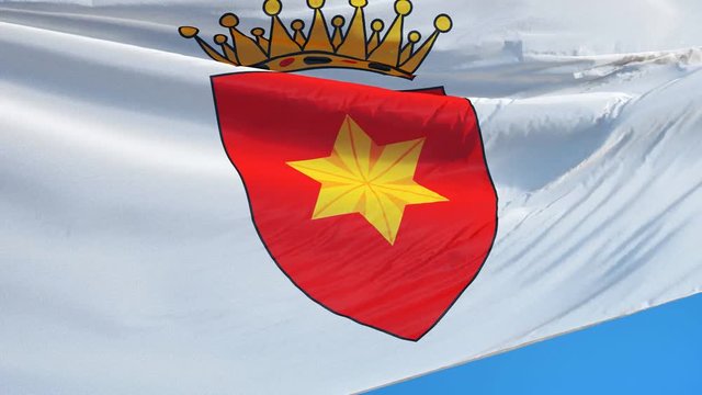 Kingdom of Tavolara flag waving in slow motion against clean blue sky, seamlessly looped, close up, isolated on alpha channel with black and white matte, perfect for film news digital composition