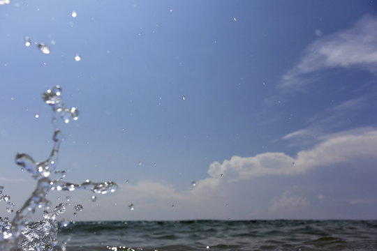 Isolated splash with clouds on the horizon. 