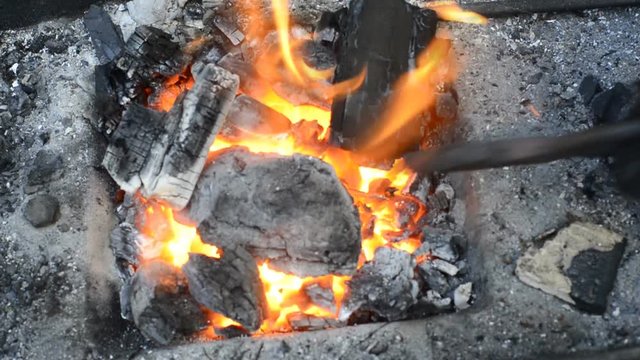 heating the product prior to treatment in hot coals