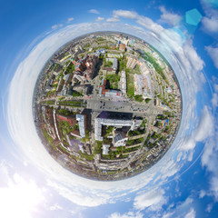 Aerial city view with crossroads and roads, houses, buildings, parks and parking lots, bridges....