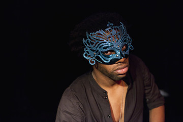 Portrait of young actor performing on stage