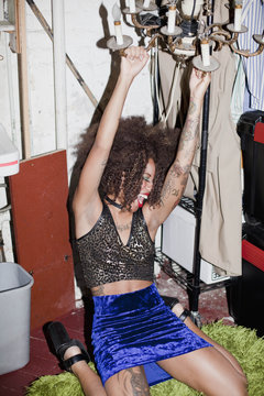 Young woman dancing backstage