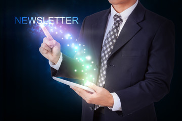 Businessman holding tablet with pressing newsletter. internet and networking concept