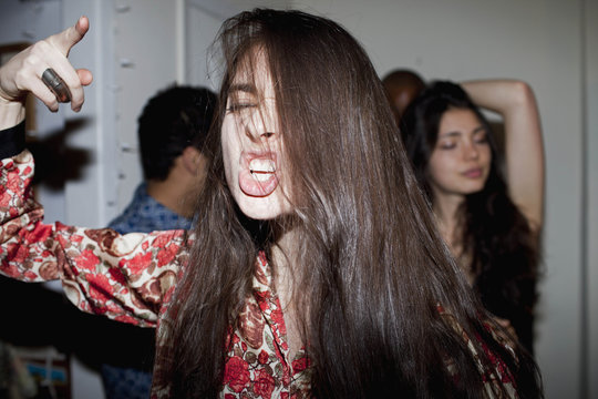 Young woman dancing at a party