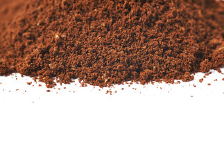 Pile of the ground coffee flakes isolated