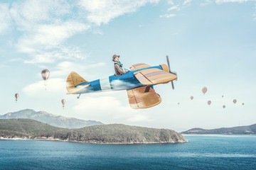 Girl flying old plane . Mixed media