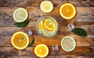 Fototapeta na wymiar glass homemade lemonade, orange, lemon, ice cube