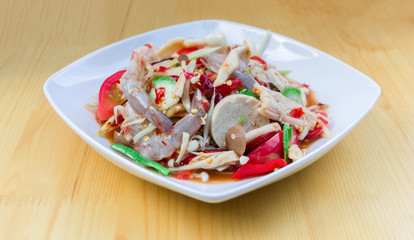 Green Papaya Salad (Som tum Thai) mixed with seafood and mushroo