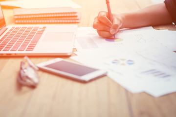 Hands of business woman manager taking notes when working on rep