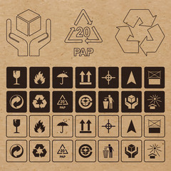 Set of vector packaging symbols on craft paper background. Icon set including waste recycling, fragile, flammable, this side up, handle with care and other caution signs.