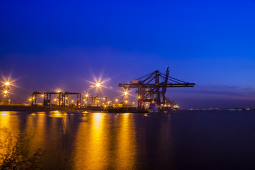 Fototapeta na wymiar in the evening，Freight dock of container crane
