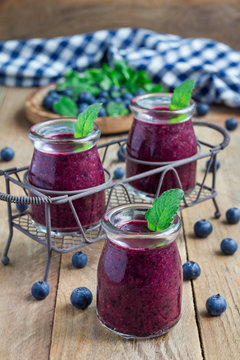 Healthy smoothie with blueberry, plum, mint and basil