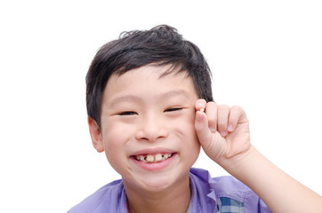 Portrait of young asian boy losing his tooth