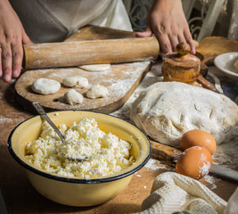 Making of varenyki or pierogy with cottage cheese (curd). Picture shows a raw product.