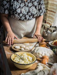 Making of varenyki or pierogy with cottage cheese (curd). Picture shows a raw product.