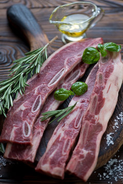 Raw fresh seasoned short beef ribs ready to be grilled, close-up