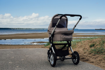 Baby stroller on beach