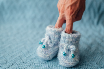 Knitted blue baby boy shoes