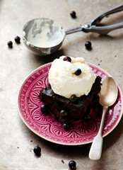 chocolate Brownie with ice cream and blackberry.