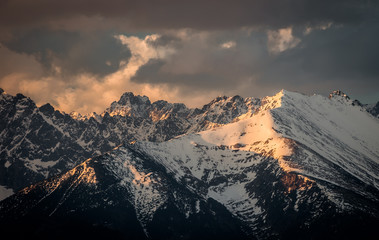 Obraz premium Cloudy Tatra mountains in the morning, covered with snow