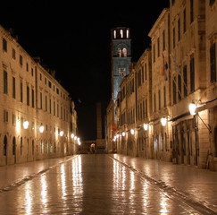 Fototapeta na wymiar Night view on the main street Stradun in Old town of Dubrovnik, Croatia. Many of historic buildings and monuments in Dubrovnik are situated along Stradun